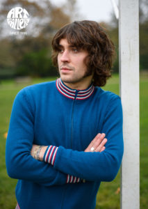 ART GALLERY CLOTHING SIXTIES MOD KNITWEAR Sailor blue, zip through funnel neck cardigan with sailor blue, red & off white striped neck, cuffs & waistband.